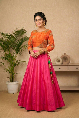 Striking Orange Embroidered Blouse with Hot Pink Silk Lehenga