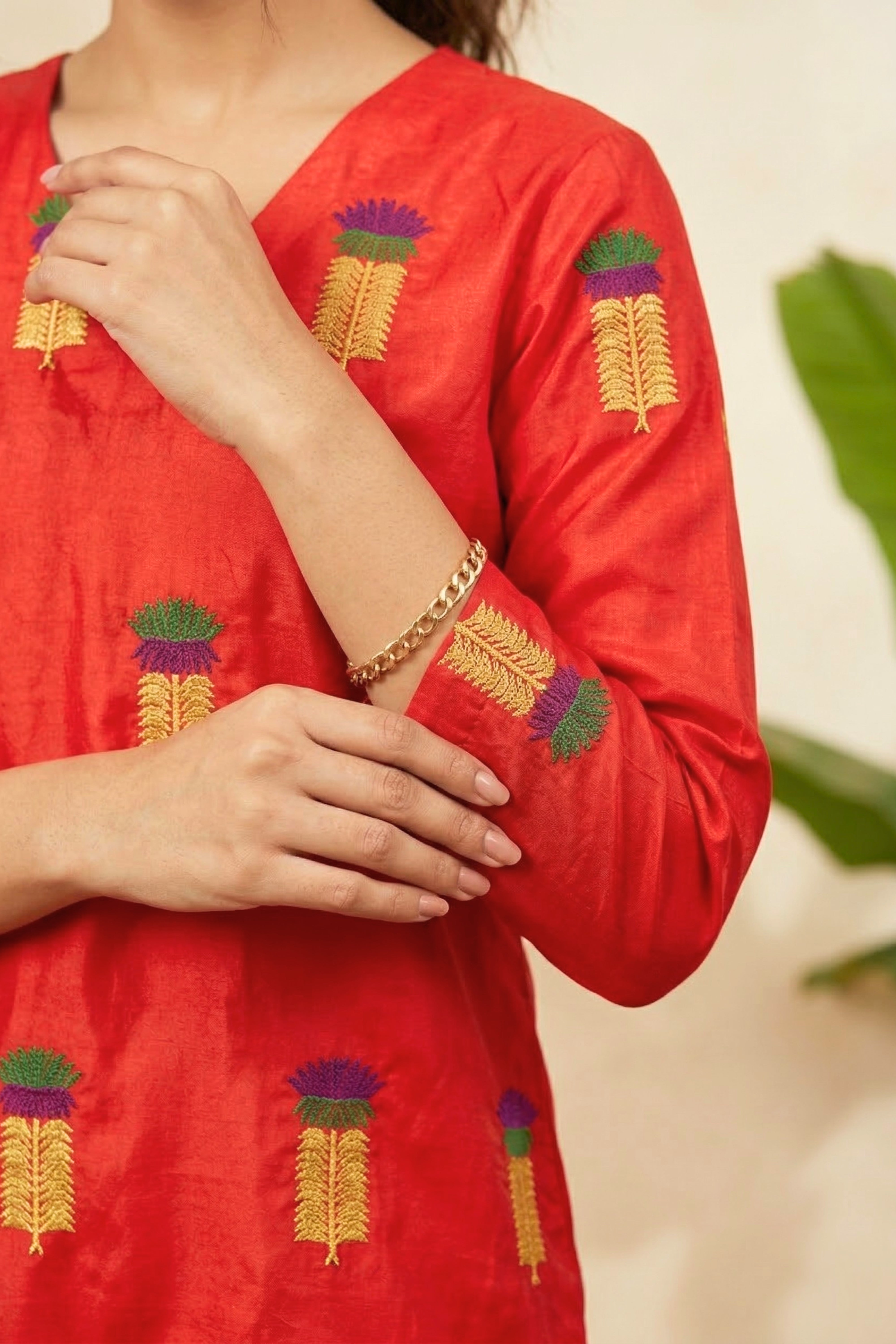 Radiant Red Silk V-Neck Kurti with Multicolored Embroidered Motifs