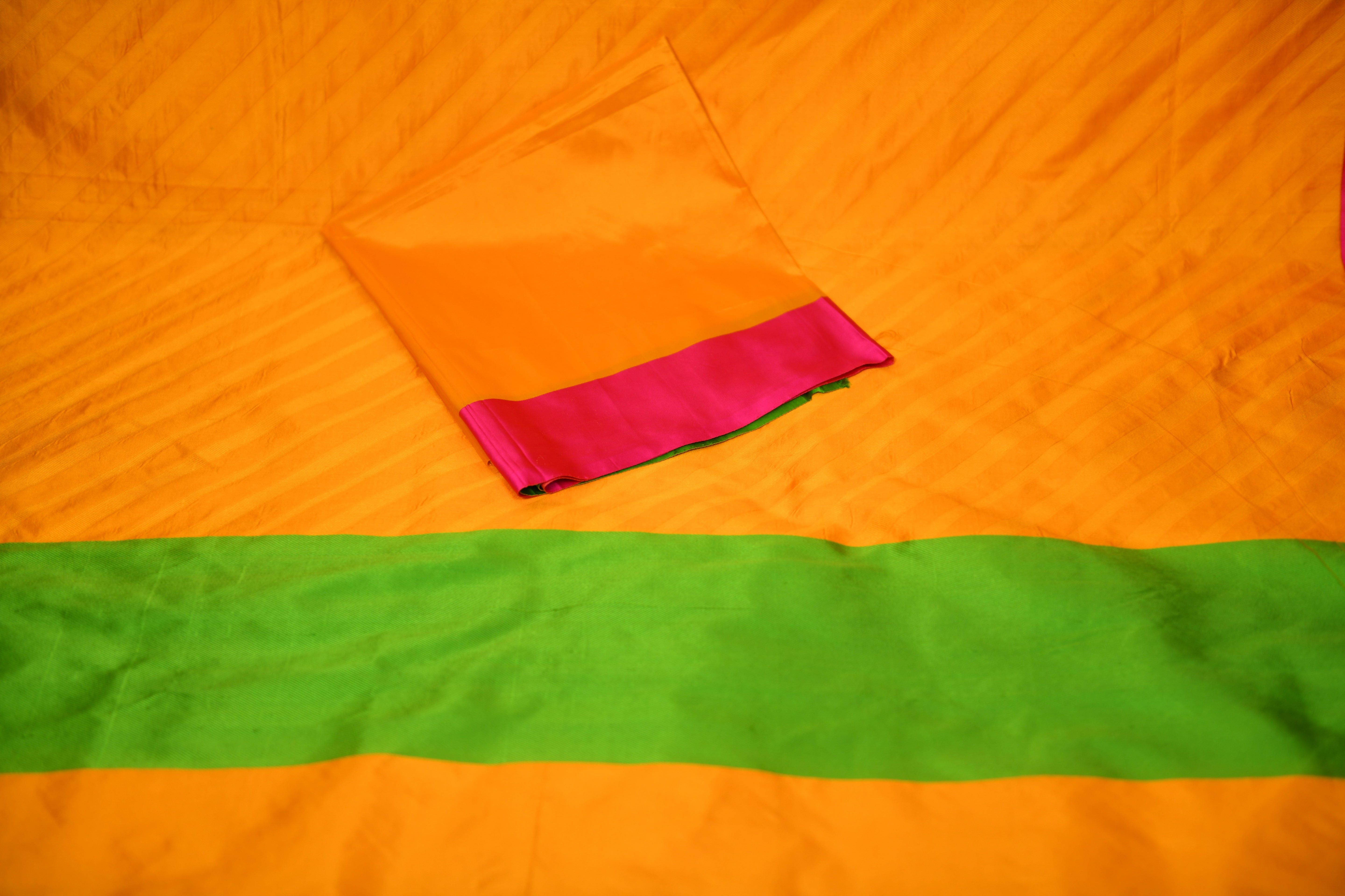 Vibrant Mango Yellow Banarasi Silk Saree with Green & Pink Borders