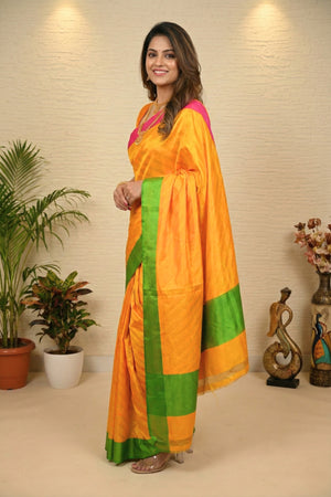 Vibrant Mango Yellow Banarasi Silk Saree with Green & Pink Borders