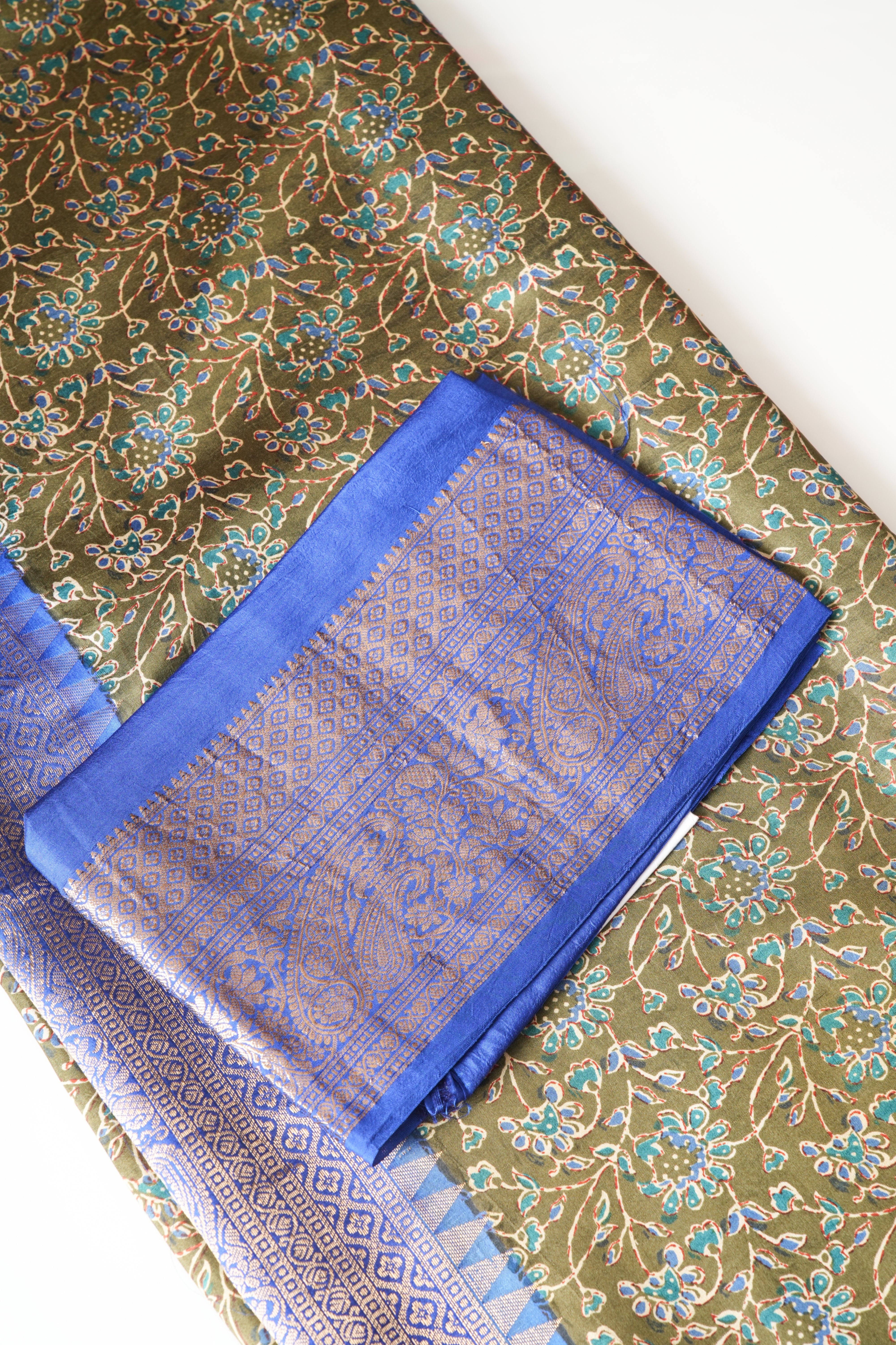 Olive Green Ajrakh Print Soft Silk Saree with Royal Blue Zari Border