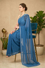 Captivating Steel Blue Georgette Saree with Statement Shoulder Motif