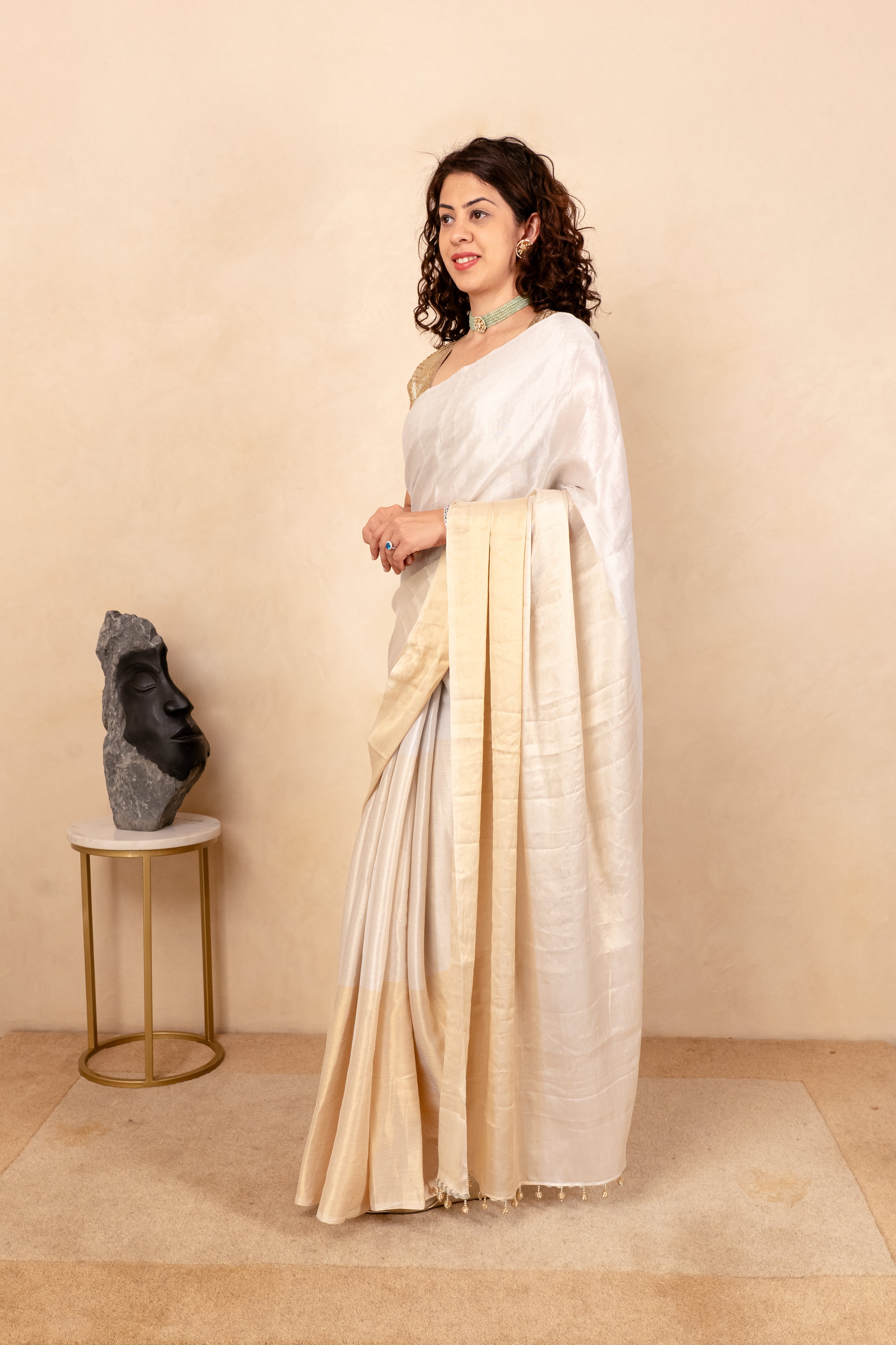 Ethereal White & Gold Soft Tissue Saree with Tassel Detailing