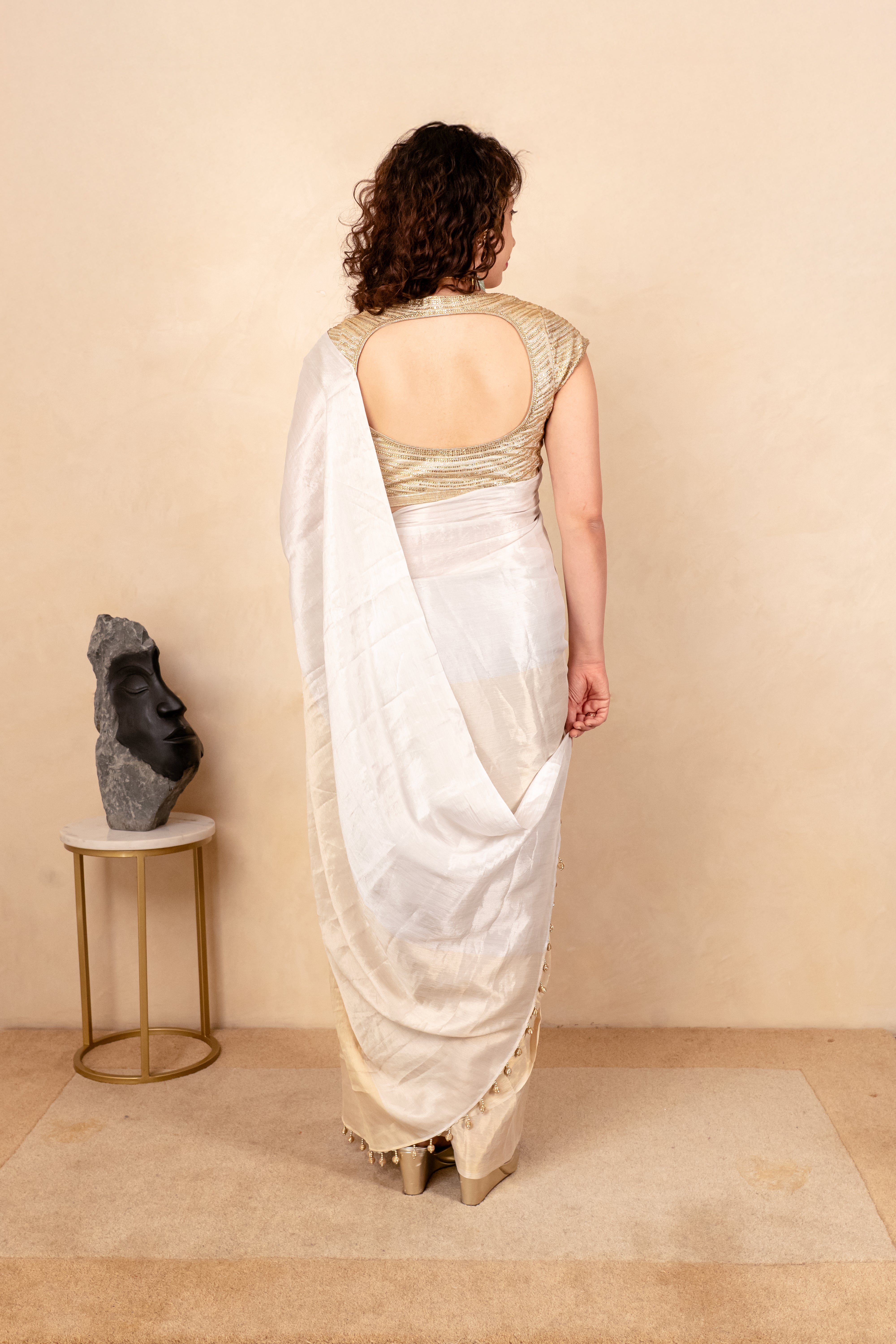 Ethereal White & Gold Soft Tissue Saree with Tassel Detailing