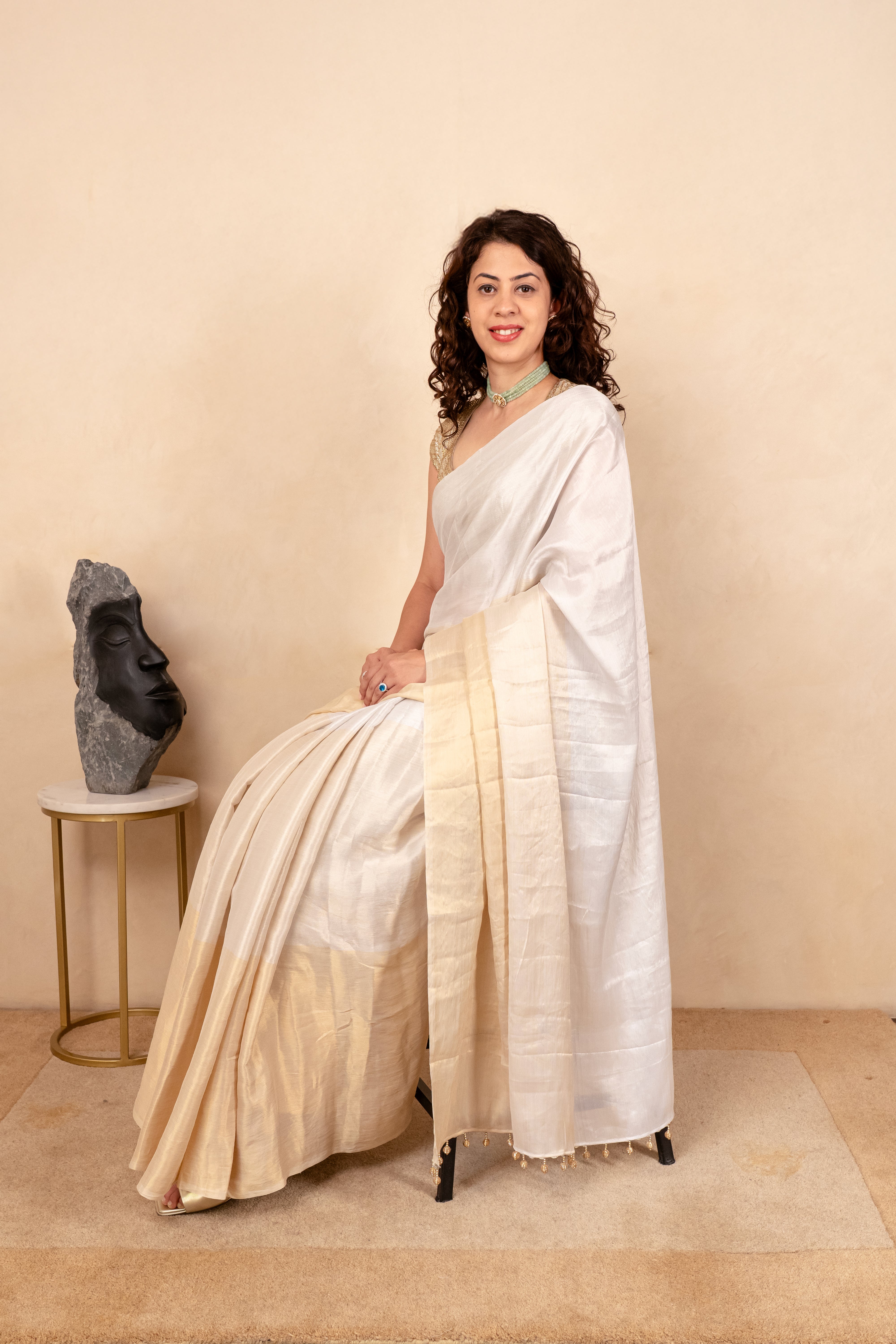 Ethereal White & Gold Soft Tissue Saree with Tassel Detailing
