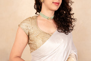 Ethereal White & Gold Soft Tissue Saree with Tassel Detailing