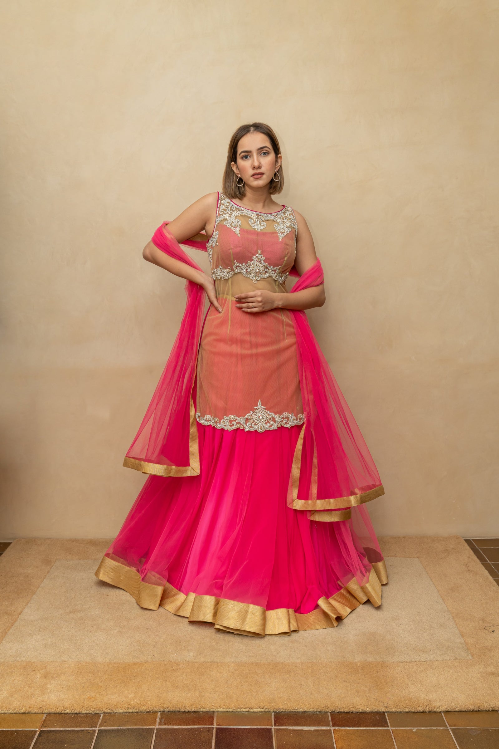 Hot pink and gold long blouse sheer lehenga set