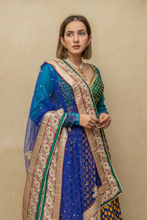 Contemporary Rama green and royal blue silk lehenga set