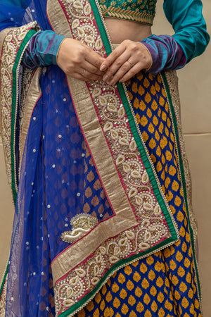 Contemporary Rama green and royal blue silk lehenga set