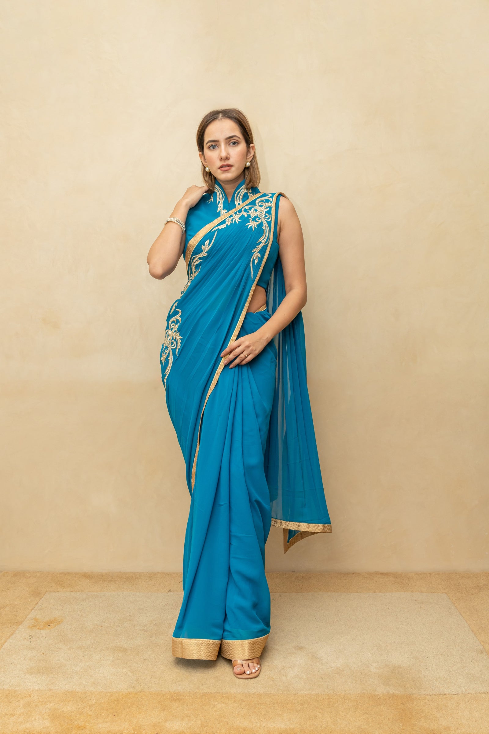 Peacock blue pre draped georgette saree and blouse set