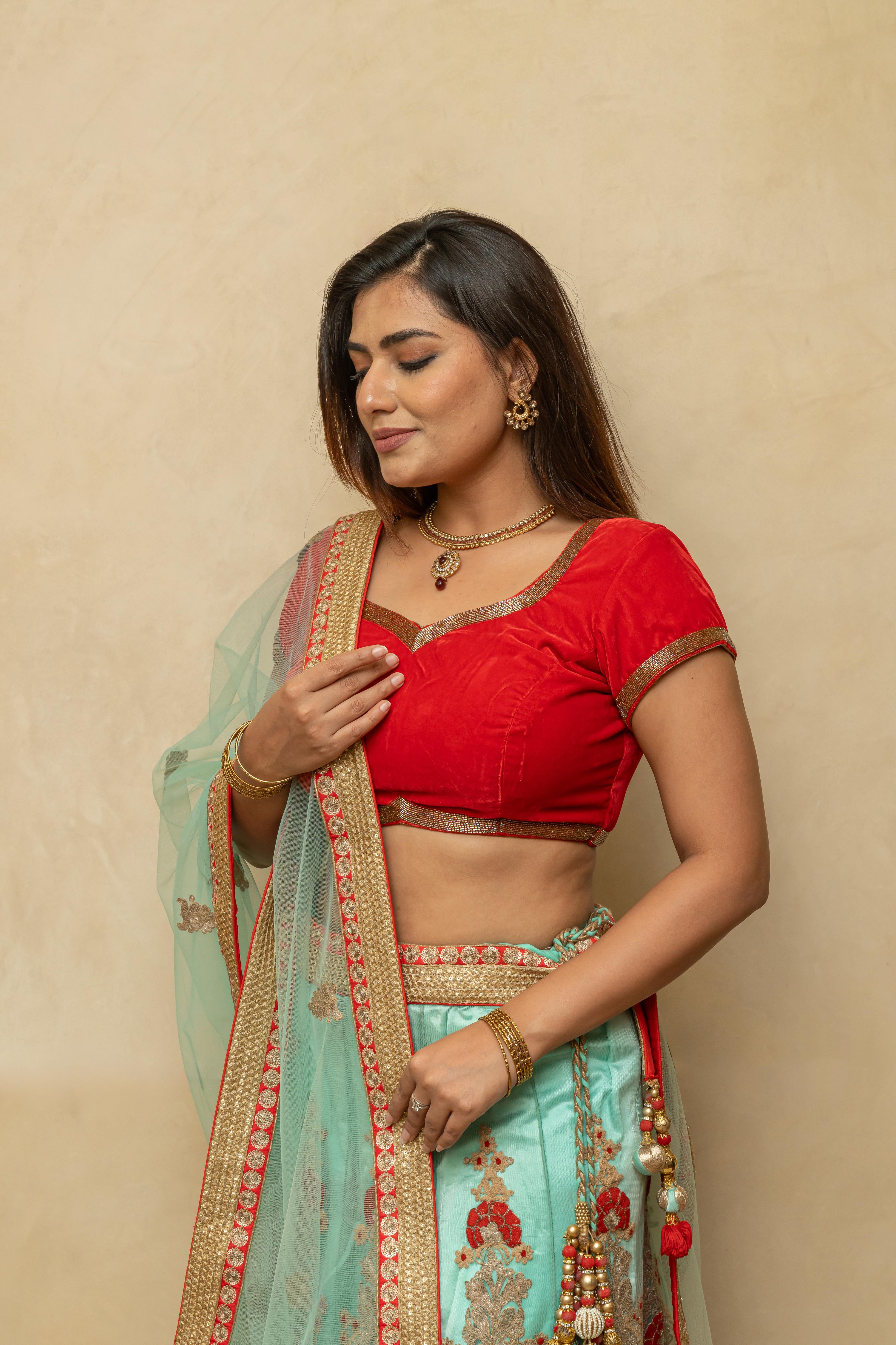 Rich turquoise blue and red threadwork lehenga set