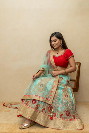 Rich turquoise blue and red threadwork lehenga set