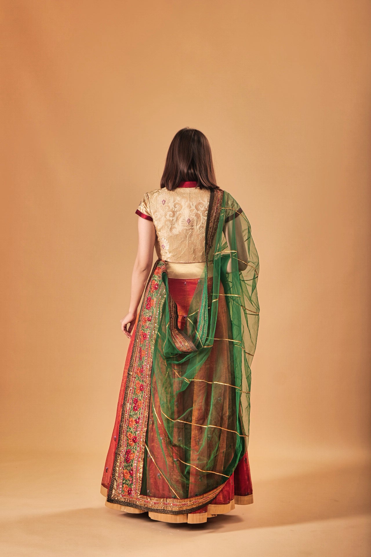 Gold Kin Khaab Indowestern blouse with Tissue silk Parsi work skirt and Soft net Gota and threadwork dupatta