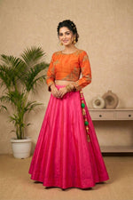 Striking Orange Embroidered Blouse with Hot Pink Silk Lehenga