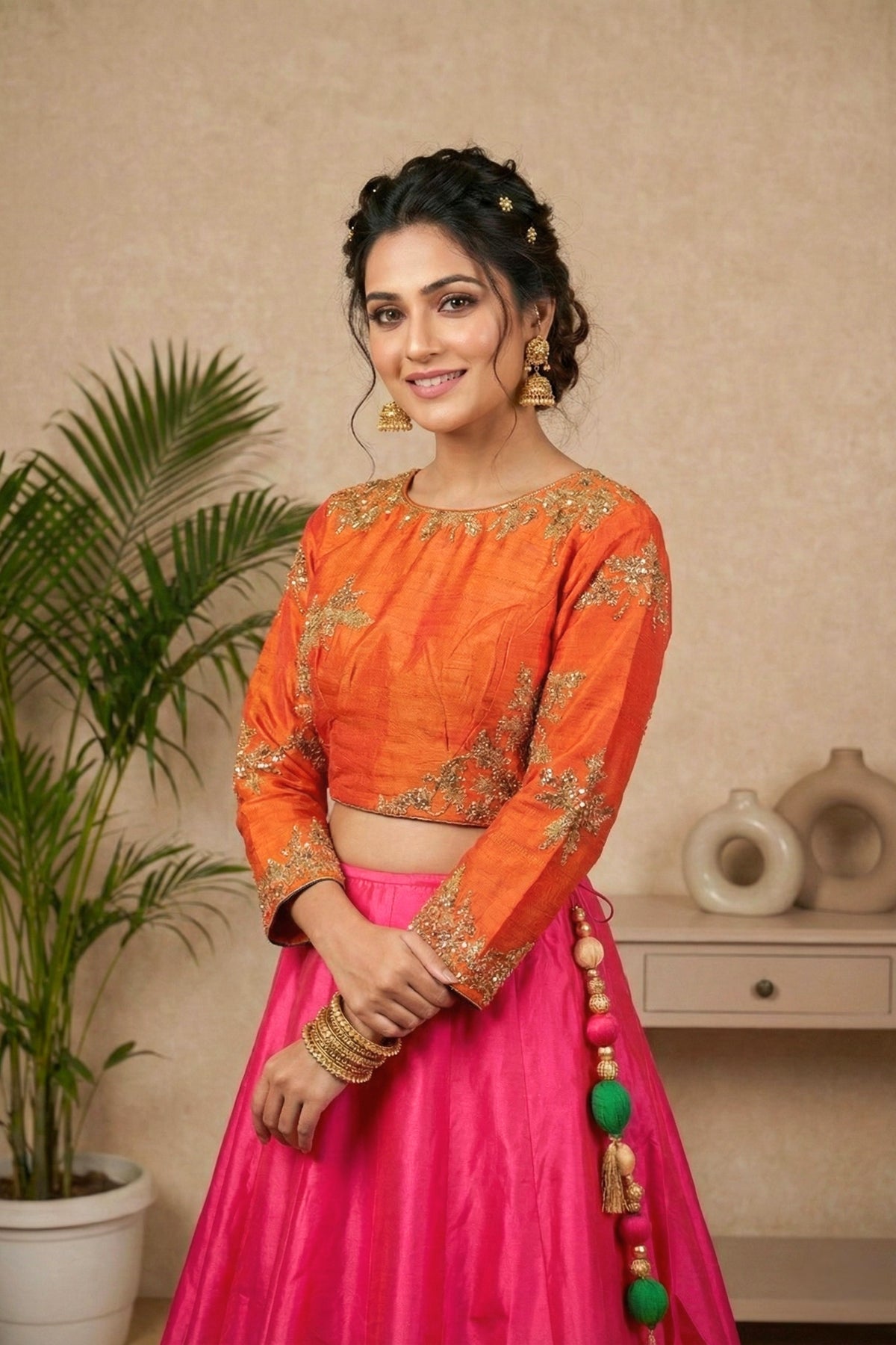 Striking Orange Embroidered Blouse with Hot Pink Silk Lehenga