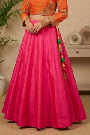 Striking Orange Embroidered Blouse with Hot Pink Silk Lehenga