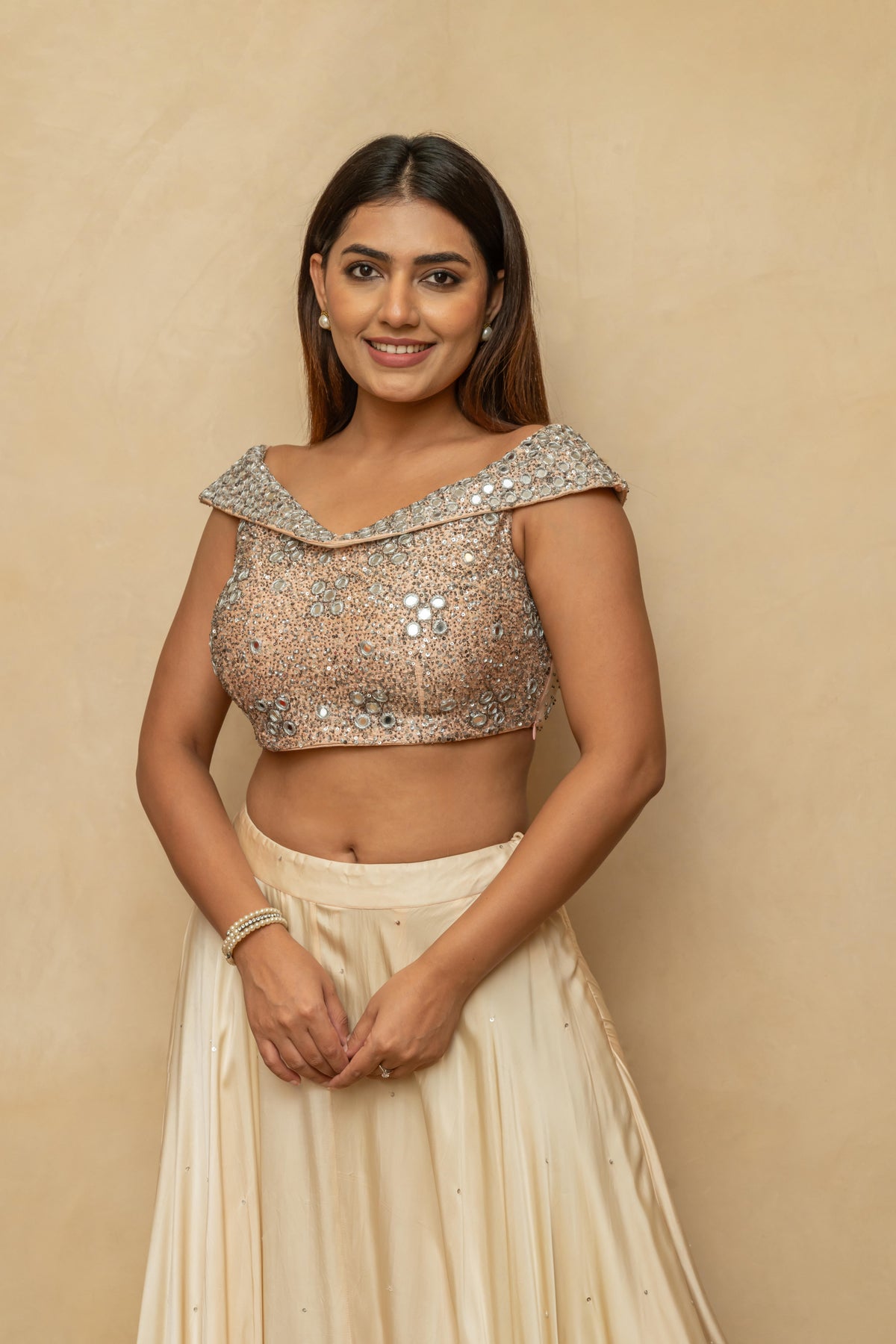 Champagne Peach Satin Silk Lehenga Set with Chunky Mirror-Work Off-Shoulder Blouse