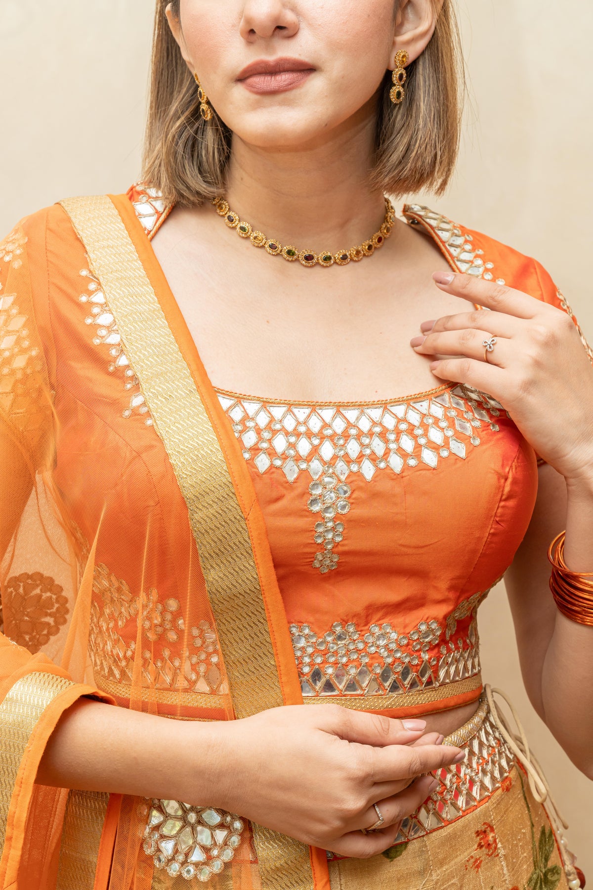 Vibrant Orange Mirror-Work Blouse with Floral Print Silk Lehenga
