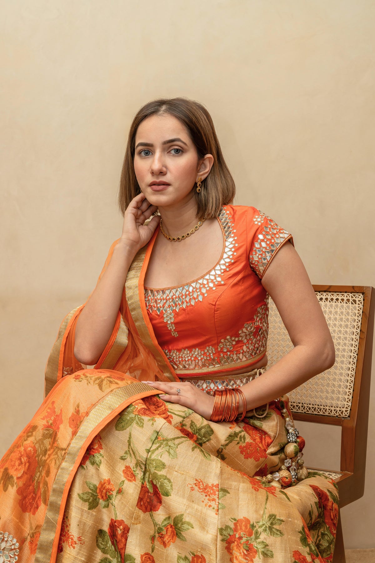 Vibrant Orange Mirror-Work Blouse with Floral Print Silk Lehenga