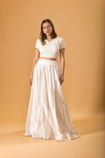 Pristine White Silk Flared Skirt and Embroidered V-Neck Blouse with Gold Accent