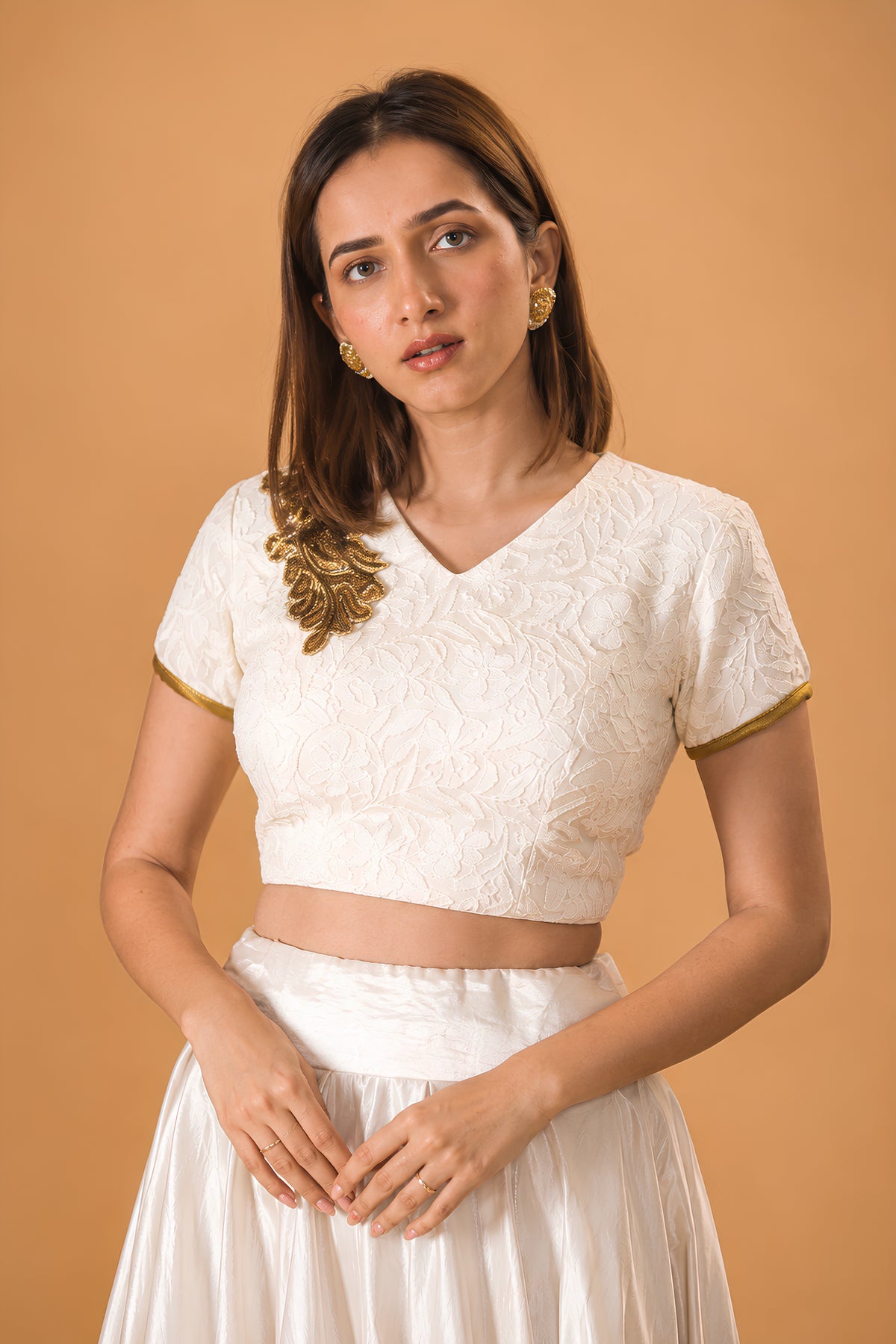 Pristine White Silk Flared Skirt and Embroidered V-Neck Blouse with Gold Accent