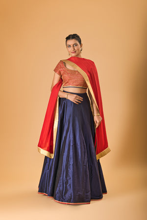 Striking Red Embellished Blouse with Navy Blue Silk Lehenga and Red Dupatta
