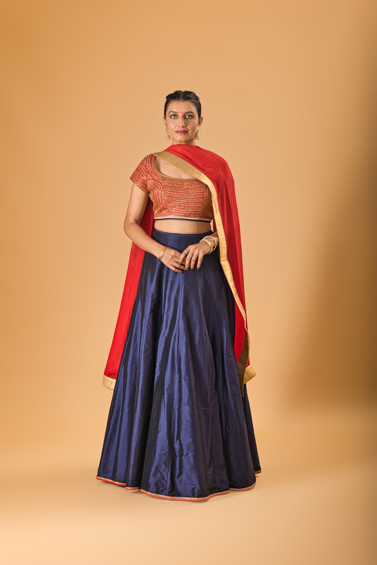Striking Red Embellished Blouse with Navy Blue Silk Lehenga and Red Dupatta