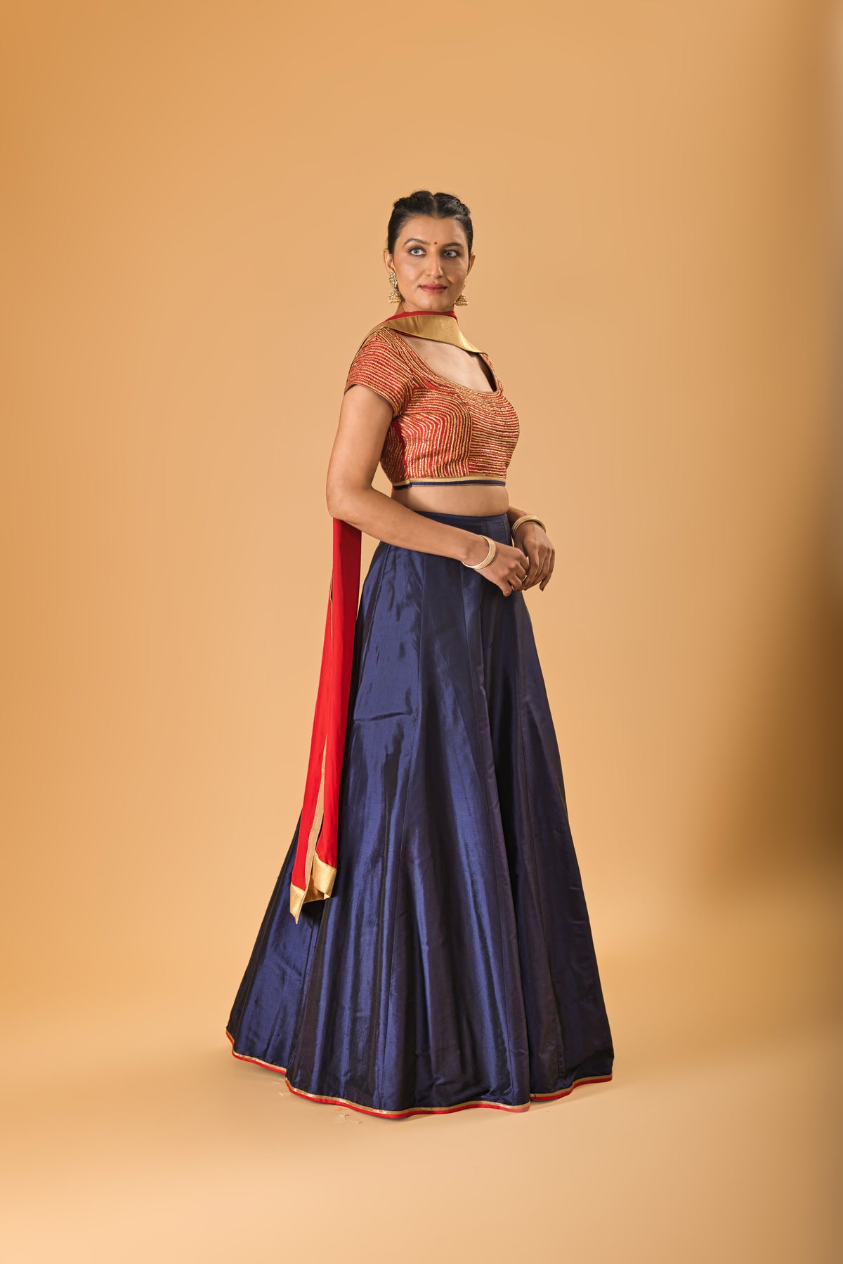 Striking Red Embellished Blouse with Navy Blue Silk Lehenga and Red Dupatta