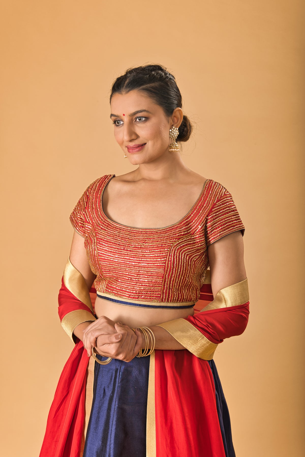 Striking Red Embellished Blouse with Navy Blue Silk Lehenga and Red Dupatta