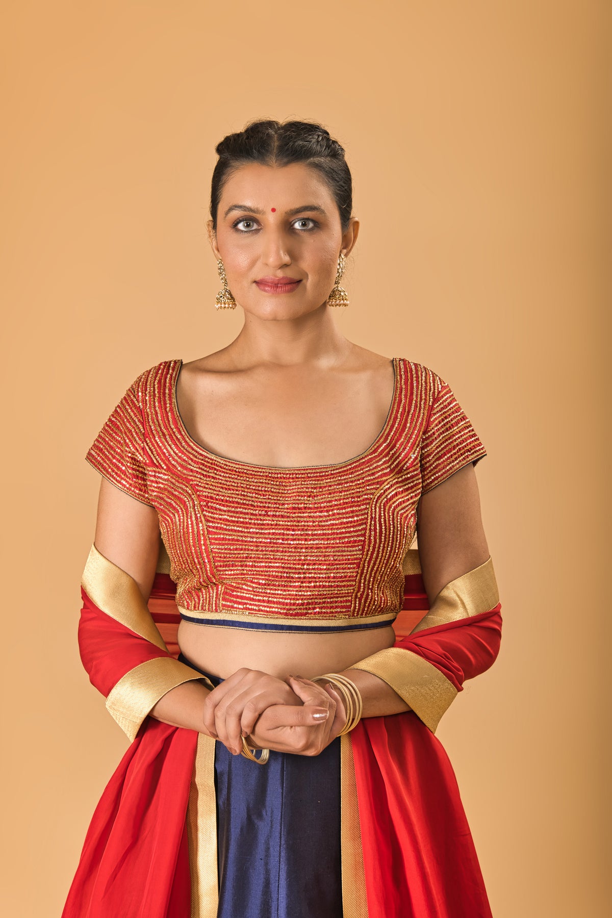 Striking Red Embellished Blouse with Navy Blue Silk Lehenga and Red Dupatta