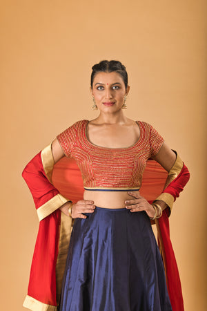 Striking Red Embellished Blouse with Navy Blue Silk Lehenga and Red Dupatta