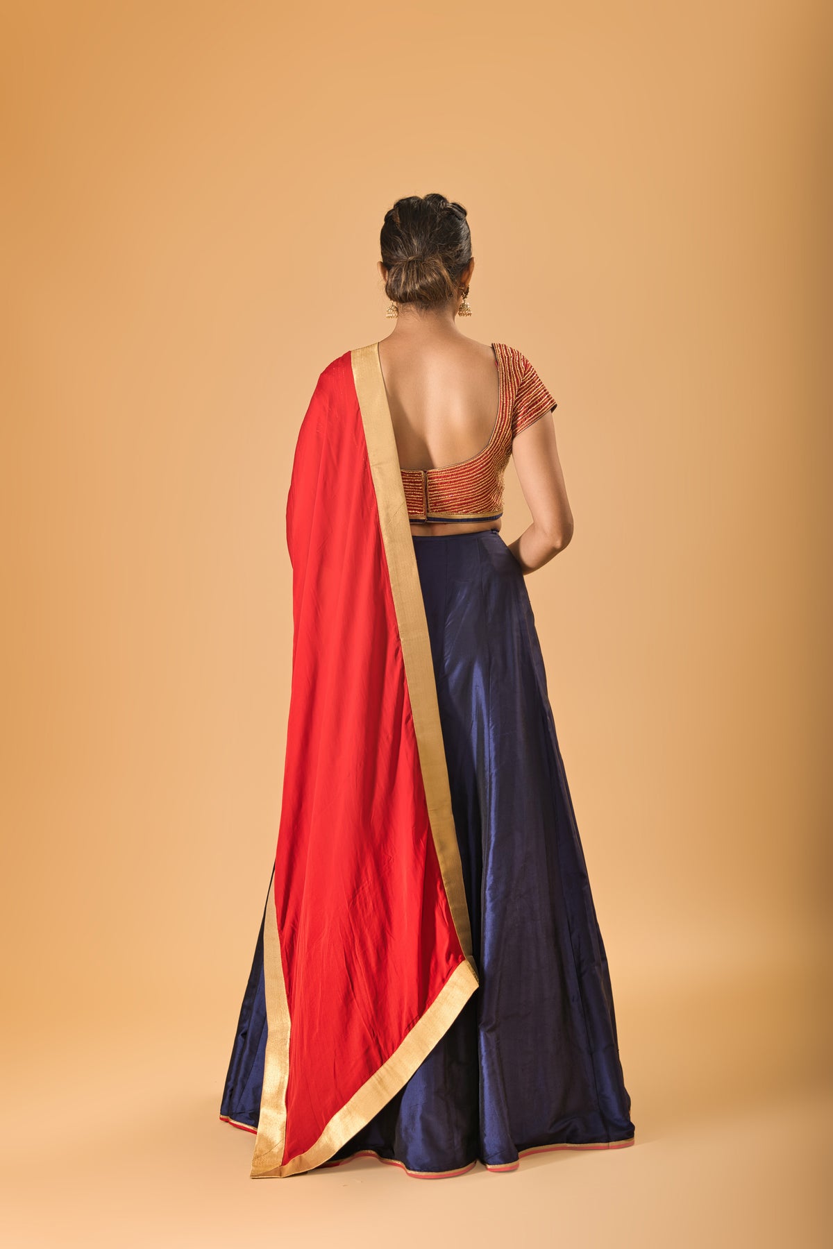 Striking Red Embellished Blouse with Navy Blue Silk Lehenga and Red Dupatta