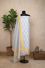 Light Grey Pure Chanderi Unstitched Suit Set with Yellow Accent by Label Tamanna