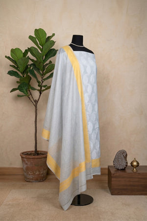 Light Grey Pure Chanderi Unstitched Suit Set with Yellow Accent by Label Tamanna