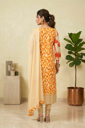Vibrant Pale Yellow Cotton Suit Set with Orange Lotus Motifs & Jeweled Placket