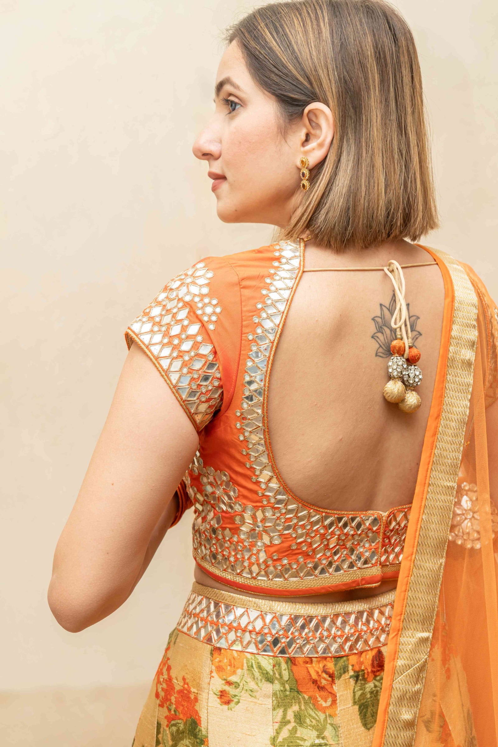 Orange floral and mirror lehenga