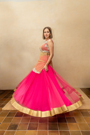 Hot pink and gold long blouse sheer lehenga set