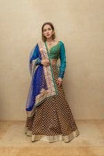 Contemporary Rama green and royal blue silk lehenga set