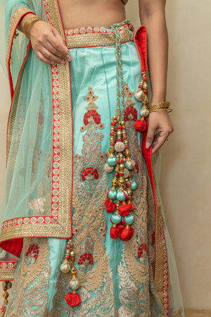 Rich turquoise blue and red threadwork lehenga set