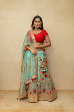 Rich turquoise blue and red threadwork lehenga set