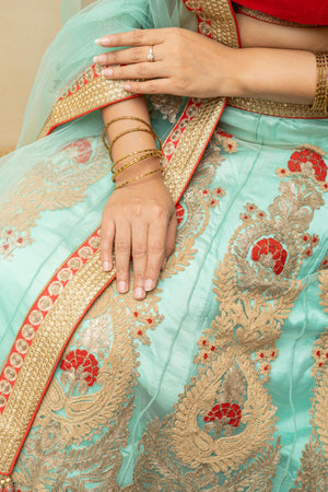 Rich turquoise blue and red threadwork lehenga set